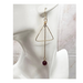 3 inch long earrings comprised of a gold wire triangl, a long gold chain and a garnet bead.